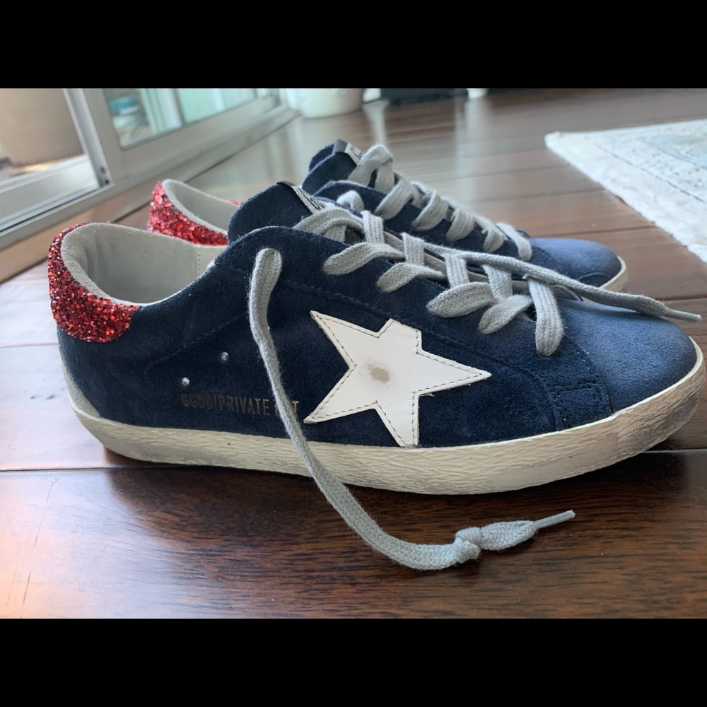 Slightly worn Golden Goose Superstar Sneakers.